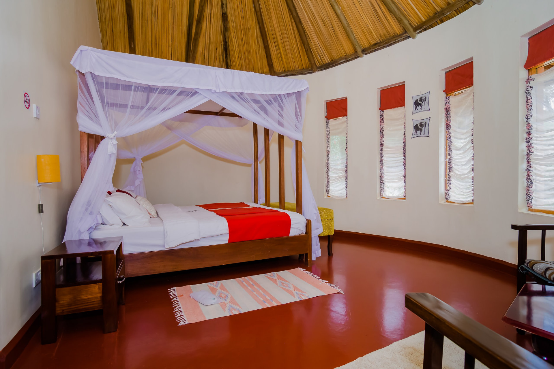Spacious bedroom with wide windows and polished floors