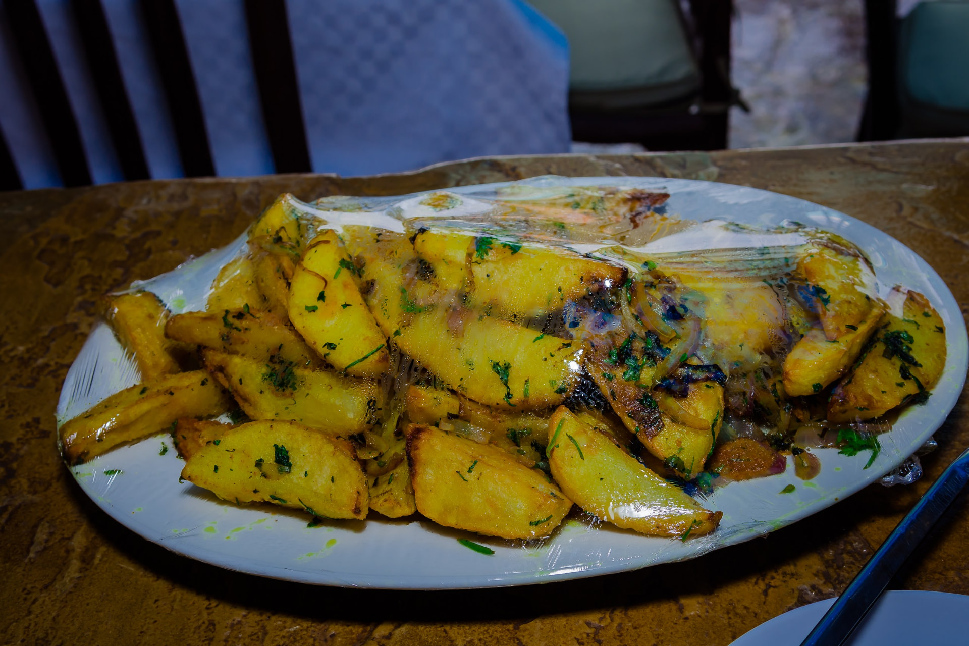 Plate of seasoned roast potatoes