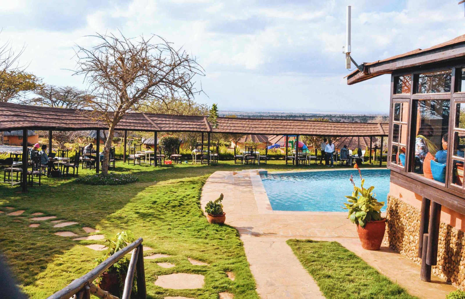 Poolside lawns and cottages at Amazing Kenya Retreat Lodge